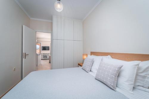 A bed or beds in a room at Asteria Apartments