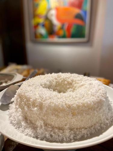 a pile of sugar on a plate on a table at Pousada João Sol in Praia do Forte