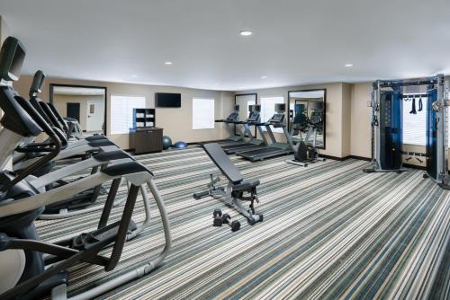 a fitness room with treadmills and cardio equipment at Candlewood Suites - Orlando - Lake Buena Vista by IHG in Orlando