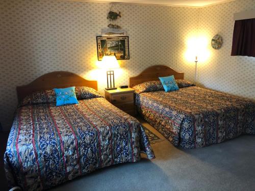 Katil atau katil-katil dalam bilik di Wells River Motel