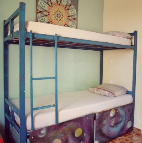 a bunk bed with two bunk beds in a room at Hostel Nossa Casa in Florianópolis