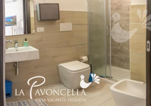 a bathroom with a toilet and a sink and a shower at Case Vacanze La Pavoncella in Teulada