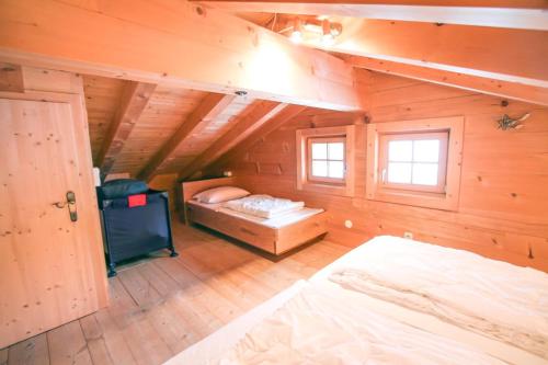 Postel nebo postele na pokoji v ubytování Chalet Königsleiten 174