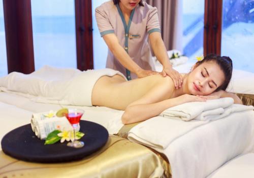 a woman getting a massage in a hotel room at Hoang Ngoc Beach Resort in Mui Ne