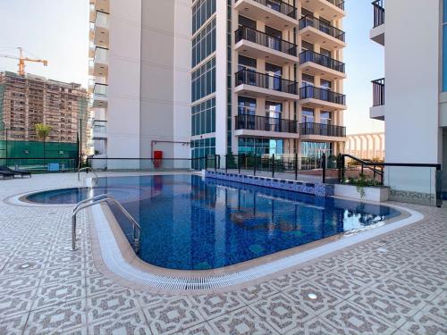 a swimming pool in the middle of a building at OYO 557 Home Starz Danube T2 -105 in Dubai