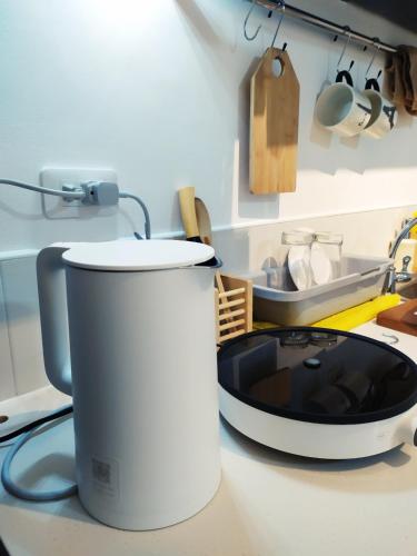 a microwave sitting on a counter in a kitchen at BH Mangrove Condos in Mactan