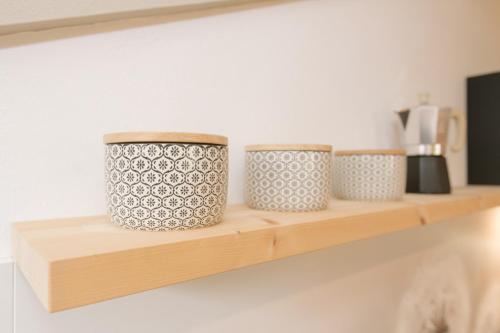 a shelf with three pots sitting on it at Ferienwohnung Sea Wieserhof in Aldino