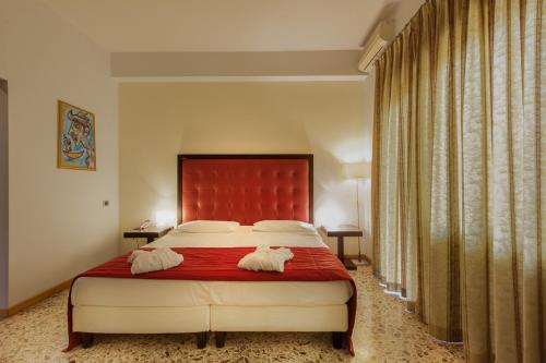 Posteľ alebo postele v izbe v ubytovaní Hotel Piazza Marconi