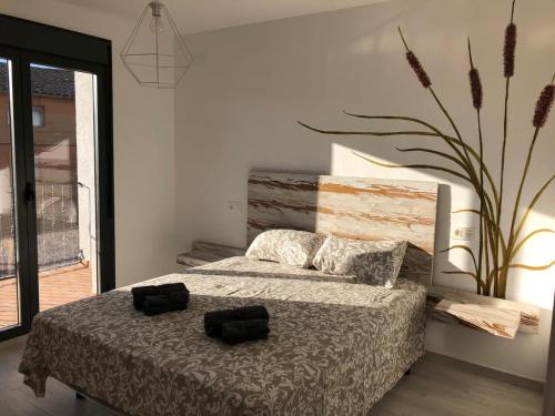 A bed or beds in a room at Las Casetas de Mateu