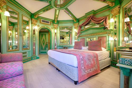 a bedroom with a bed and a chair at Club Hotel Sera in Antalya