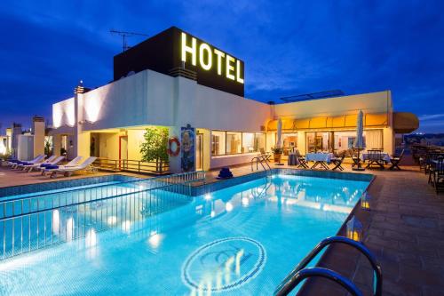 a hotel swimming pool in front of a hotel at Hotel Royal Plaza in Ibiza Town