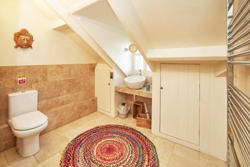 a bathroom with a toilet and a sink at Dillons of Whitby in Whitby
