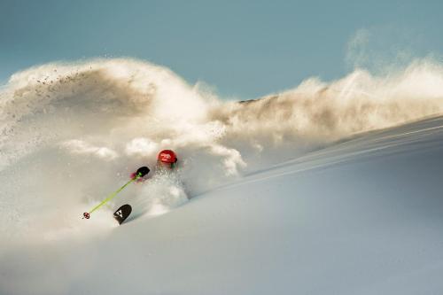 a person is skiing down a snow covered slope at Hotel in the HEART of the Alps in Uttendorf
