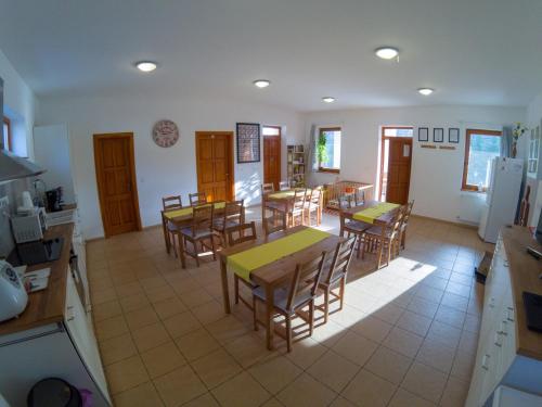 an overhead view of a kitchen with tables and chairs at Kun Pista Vendégház in Vértesboglár