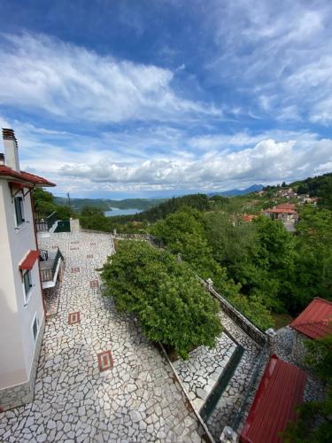 a view of a stone walkway from a building at Nefeles in Neochori