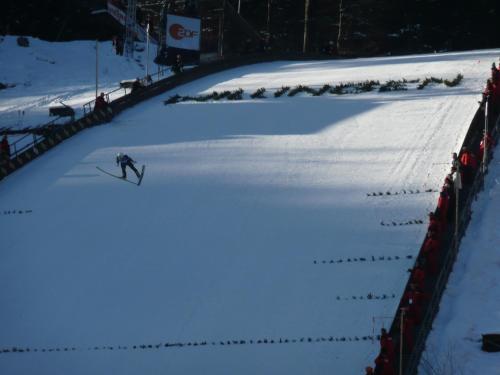 a person is skiing down a snow covered slope at Hotel Goldflair am Rathaus in Korbach