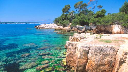 a view of the ocean from a rocky shore at MAISON PICASSO - Jacuzzi, vue, terrasse for 6 in Antibes
