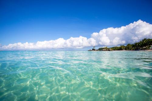 a large body of water with an island in the background at Franky Villa in Boracay