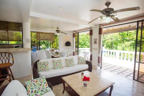 a living room with a couch and a table at Franky Villa in Boracay