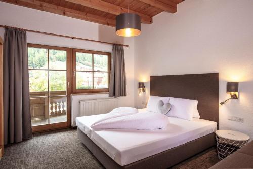A bed or beds in a room at Vizensn Living