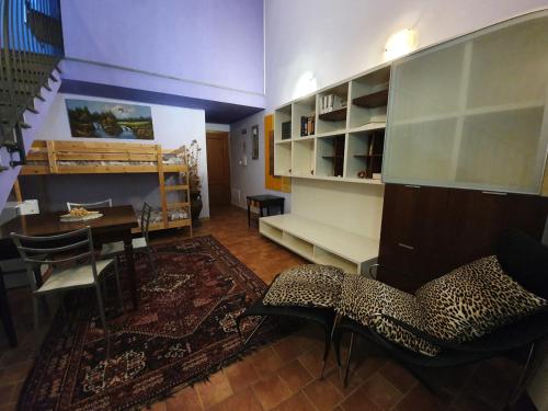 a living room with a table and a dining room at Bio Agriturismo Valle dei Calanchi in Castiglione in Teverina