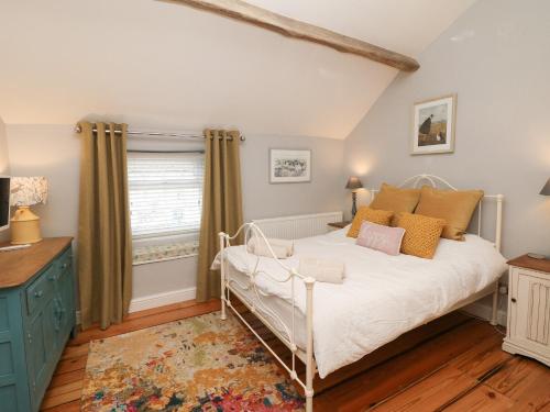 מיטה או מיטות בחדר ב-Millstream Cottage