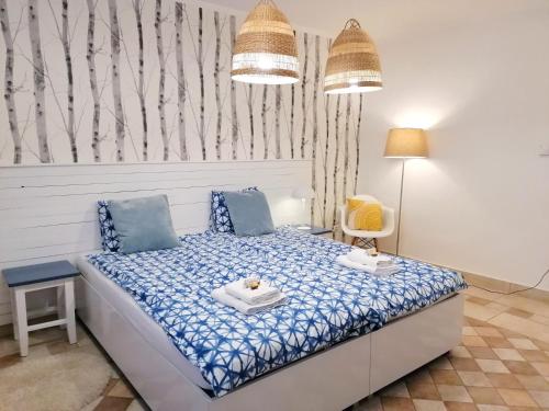 Voodi või voodid majutusasutuse Jászberény Boutique Room toas