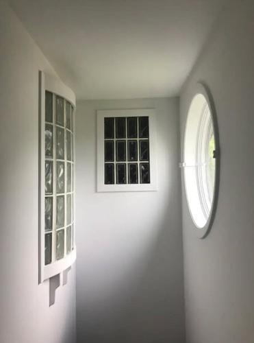 a room with a window and a white wall at Hudson Riverfront Home in Catskill