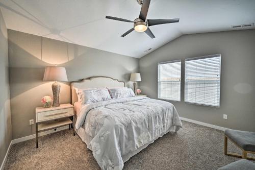 a bedroom with a bed and a ceiling fan at Modern Caldwell House with Yard and Furnished Patio! in Caldwell
