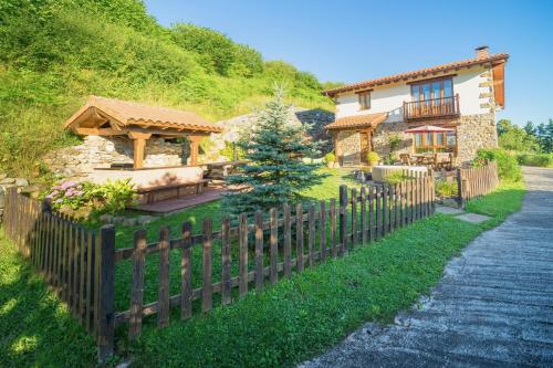a wooden fence in front of a house at Mirador de Ceballos in Sarceda