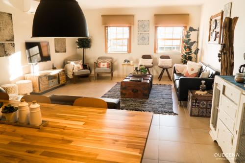 a living room with a couch and a table at Casa Aldeia da Lapa in Sernancelhe