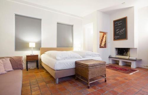 Ένα ή περισσότερα κρεβάτια σε δωμάτιο στο Ground floor Jordaan Apartment