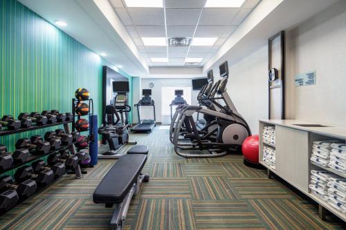 a gym with treadmills and elliptical machines at Holiday Inn Express & Suites Florence by IHG in Florence