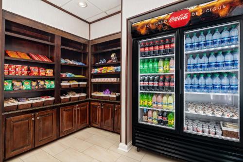 a refrigerator filled with lots of sodas and drinks at Holiday Inn Express & Suites Florence by IHG in Florence