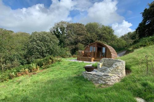 a gazebo in the middle of a grass field at Birdsong Lodge in Woolacombe