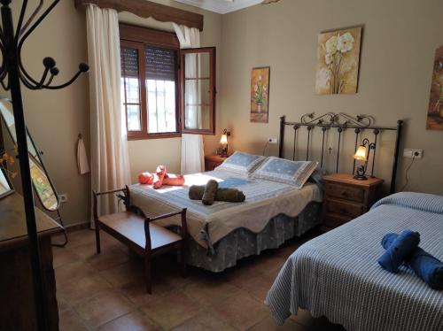 A bed or beds in a room at LOS ABUELOS