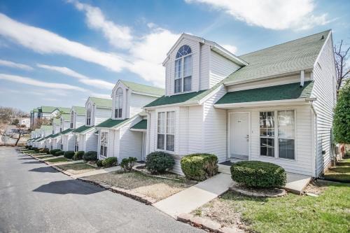 a row of white houses on a street at The Townhouses in Branson