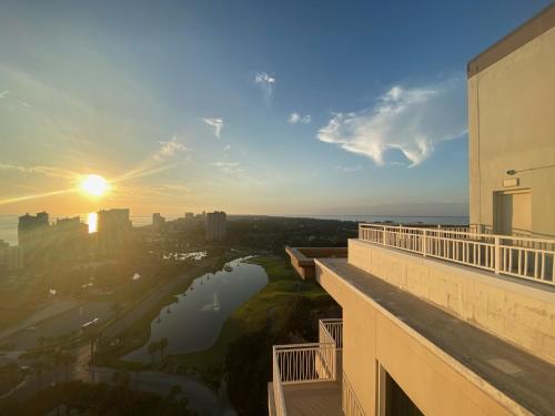 a view from the balcony of a building at sunset at Ocean View Luxurious Condo-BEST location + balcony in Destin