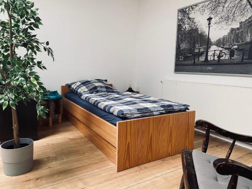Postel nebo postele na pokoji v ubytování Ferienwohnung Tulpenweg mit Kaminofen