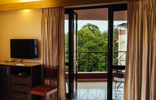 TV a/nebo společenská místnost v ubytování Hotel Arcadia