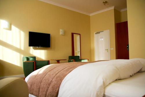 Cama o camas de una habitación en Fründts Hotel