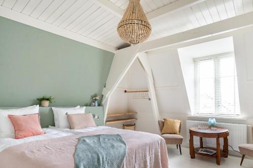 Postel nebo postele na pokoji v ubytování Boutique Hotel - de Stadsherberg Alphen