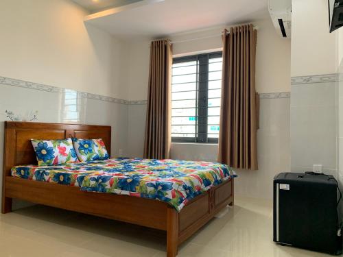 a bedroom with a bed and a window at The Fiii Homestay&Beauty in Vung Tau