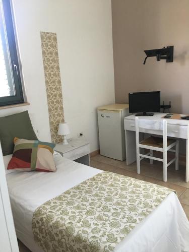 TV a/nebo společenská místnost v ubytování Paradiso della Zagara