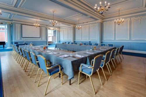 a large conference room with a long table and chairs at Hydro Hotel in Eastbourne