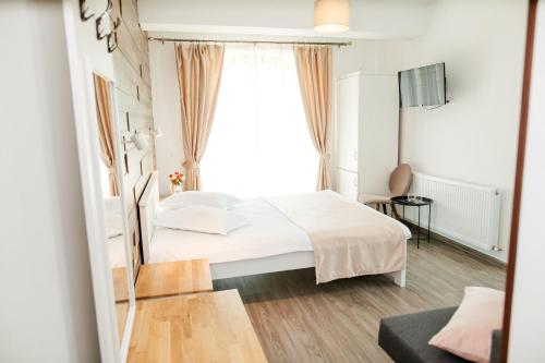Postel nebo postele na pokoji v ubytování Casa Iarina