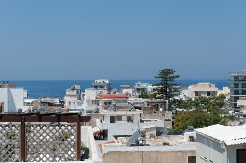 
a large building with a view of the ocean at Atlantis Boutique City Hotel in Rhodes Town
