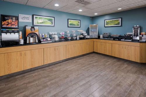 a cashier counter in a coffee shop with a customer at Sleep Inn & Suites Port Clinton in Port Clinton