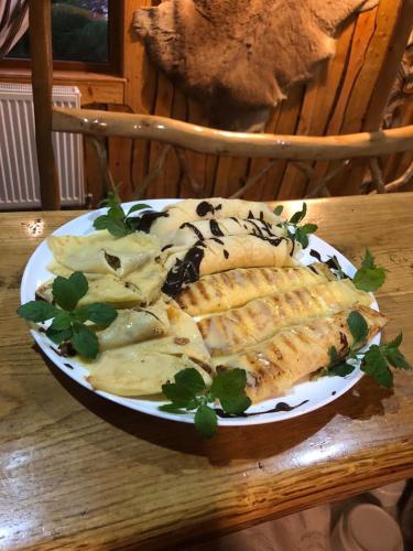 a plate of fish and potato chips on a table at Sadyba Pidkova Чан сауна Приймаємо групи до 70людей in Pistyn