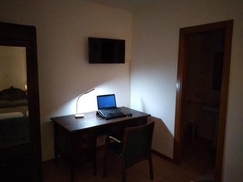 a laptop computer sitting on a desk in a room at HOTEL B&B RESORT Fonte La Castellana in Sarnano